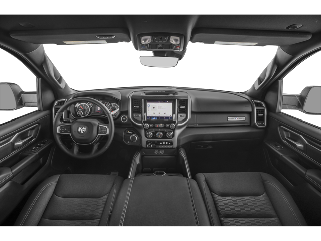 Car interior featuring dashboard, steering wheel, and touchscreen display with navigation map.